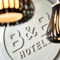 two lights on a plate with the words bbb photography at B&B HOTEL Liège Rocourt