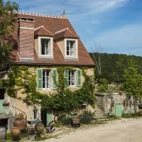 an old house with green shutters on a street at Le Domaine des Carriers - Gites, Chevroches