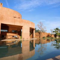 a desert house with a pool in front of it at Loop - An hedonist house, Tameslouht