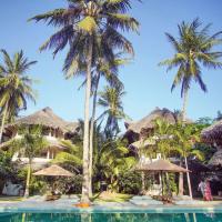 a resort with palm trees and a swimming pool at Palm Garden Boutique Hotel, Watamu