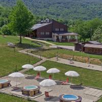 an aerial view of a park with tables and umbrellas at B&B Villa Irene Plitvice Lakes, Seliste Dreznicko