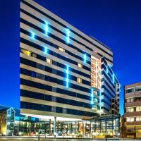 a large building with blue lights on it at Clarion Hotel The Edge, Tromsø