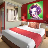 a bedroom with a large bed with a painting on the wall at Clarion Congress Hotel Bratislava