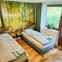 a bedroom with two beds and a mural at Waldzimmer Rosengarten bei Hamburg