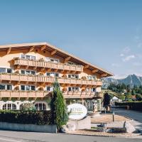 a large building on the side of a road at HENRI Country House Seefeld, Seefeld in Tirol