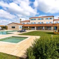 a large house with a swimming pool in a yard at VELANERA Hotel & Restaurant, Medulin