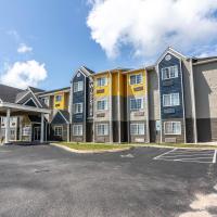 a large apartment building with a parking lot at The Windstar Hotel - Carolina Beach