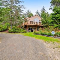 a home with a driveway leading to a house at Huckleberry Haven, Tillamook