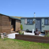 a backyard of a house with a wooden shed at Heather Hut at Copy House Hideaway, Barnoldswick