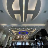 a lobby with a large logo on the ceiling at Ararat Hotel, Bethlehem