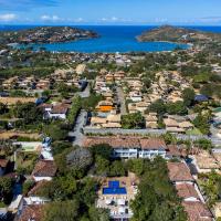 an aerial view of a town with houses and the ocean at Hotel Miratlantico Búzios
