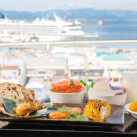 a tray with food on a table with a view of a harbor at Hotel Resol Hakodate