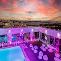 a house with a swimming pool and purple lighting at HF Ipanema Park, Porto