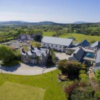 an aerial view of a large house with a yard at Castle Dargan Hotel, Sligo