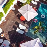 an overhead view of a swimming pool with umbrellas at Le Martin Boutique Hôtel, Saint Martin