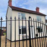 Delightful 2 bed detached home with secure parking