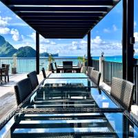 a pool on the deck of a house with a view of the ocean at S Resort El Nido