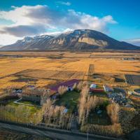 an aerial view of a mountain in the middle of a field at Hotel Hacienda Dorotea, Puerto Natales