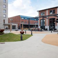 a street in a city with buildings and a park at JECI Apartment Frogner Lillestr&oslash;m - Modern and Central