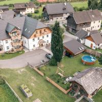 an aerial view of a large house with a yard at Landhaus Holzer, Sankt Margarethen im Lungau