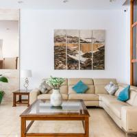 a living room with a couch and a table at Hotel Andrea´s, Los Cristianos