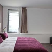 a bedroom with a large bed and a window at Best Western Plus Villa Saint Antoine Hotel & Spa, Clisson