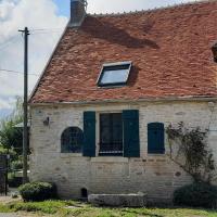 an old stone house with a red roof at Spacious holiday home in Ni vre with a garden, Breugnon