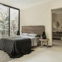 a bedroom with a bed and a large window at Extraordinaria Eco- Casa- Selva- Relax-Wifi 50mbps, Francisco Uh May