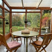 House with a magical garden and sunroom