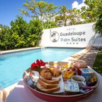 a tray of food on a table next to a pool at Hôtel Guadeloupe Palm Suites, Saint-François