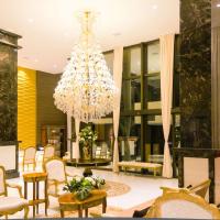 a large lobby with a chandelier and chairs at Majestic Ponta Negra Beach,WorldHotels Elite, Natal