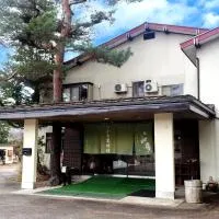 Guest Room Furusatomura Kogeikan, хотел в Омачи