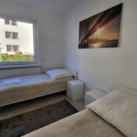 Monteurzimmer mit zwei einzelnen Betten in einer 3Zi Wohnung mit Küche und Bad