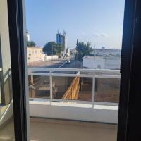 a window with a view of a city street at Djibguesthouse, Djibouti