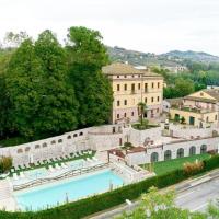 an aerial view of a building with a swimming pool at Hotel Corte dei Tini, Teramo