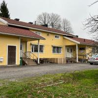a yellow house with a car parked in front of it at DAG-15, Korppoo