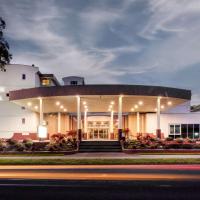 a large white building with lights on it at Arawa Park Hotel, Independent Collection by EVT, Rotorua