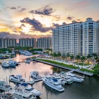 a group of boats docked in a marina with buildings at The Westin Cape Coral Resort at Marina Village