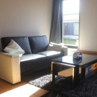a living room with a couch and a coffee table at Cozy one room apartment, Albertslund