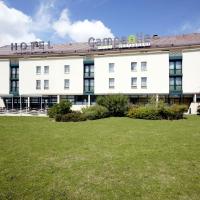 a hotel with a large lawn in front of it at Campanile Marne la Vallée - Bussy Saint-Georges, Bussy-Saint-Georges