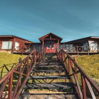 a stairway leading up to a house with a building at Boutique Hotel La Cantera, El Calafate