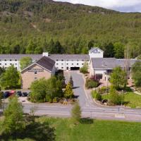 an aerial view of a town with a mountain at Macdonald Highlands Hotel at Macdonald Aviemore Resort