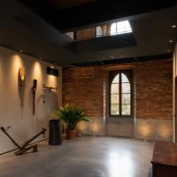 a large room with a brick wall and a window at Agriturismo Padernello, Borgo San Giacomo
