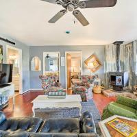 a living room with furniture and a ceiling fan at Quaint Claremore Farm House - Pet Friendly!