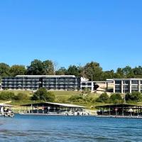 a view of a resort from the water at Lake Norfork Resort, Henderson