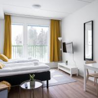 a bedroom with a bed and a living room at Hiisi Homes Järvenpää