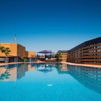 a large swimming pool in front of a building at Eurostars Palace, Córdoba
