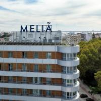 a building with a meena sign on top of it at Melia Setubal, Setúbal