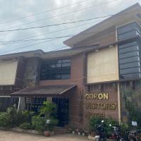 a building with a sign that says cobon visitors hotel at Coron Visitors Hotel