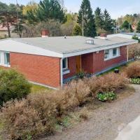 a red brick house on the side of a road at Omakotitalo, Pansio (near Meyer gate), Turku